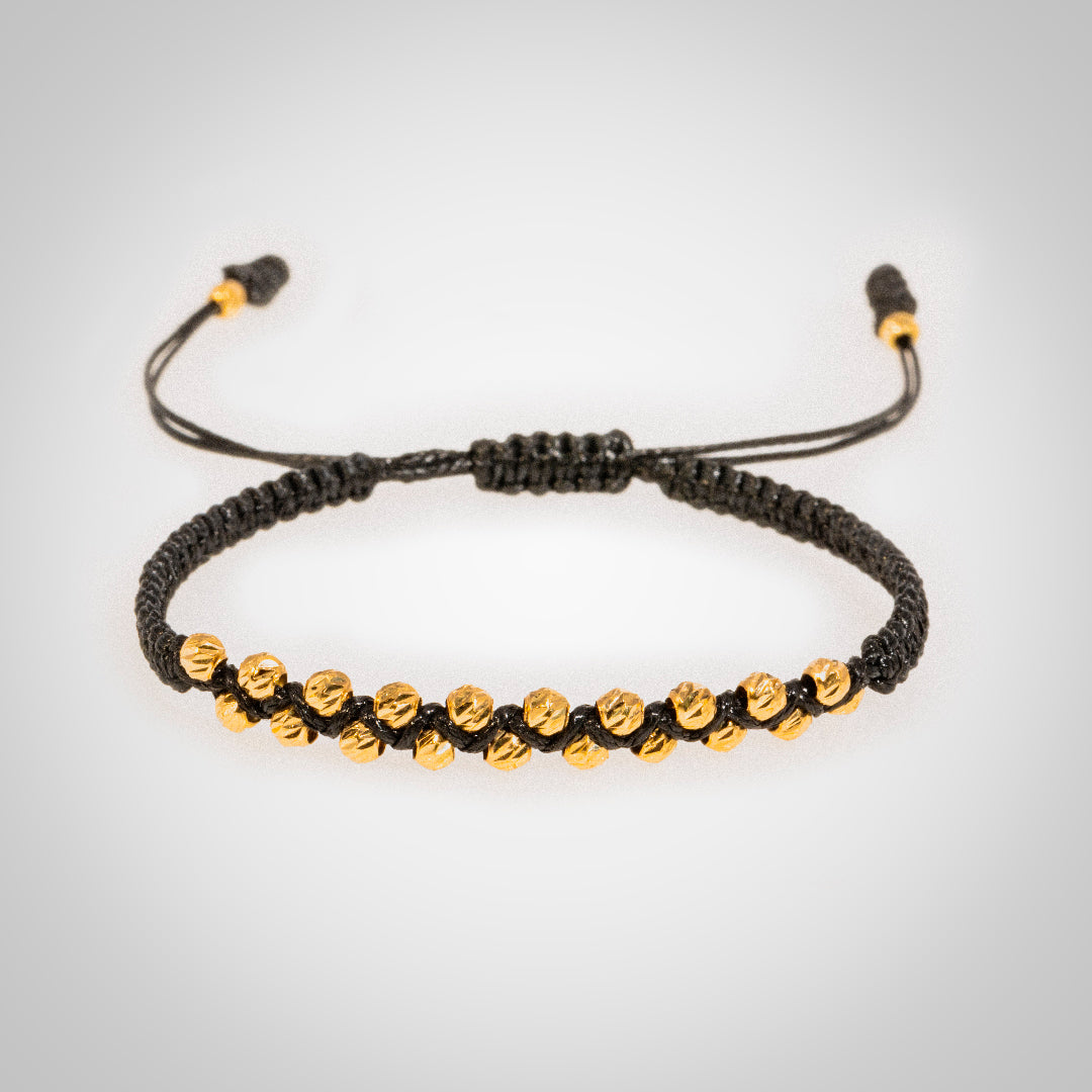 Pulsera Ixia con bolas diamantado en oro de 18K
