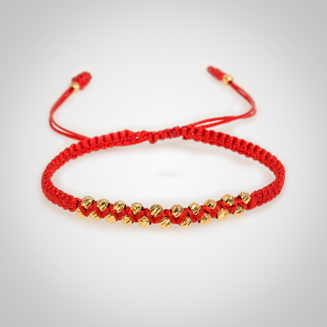 Pulsera Ixia con bolas diamantado en oro de 18K