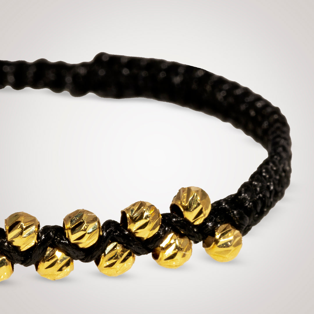 Pulsera Ixia con bolas diamantado en oro de 18K