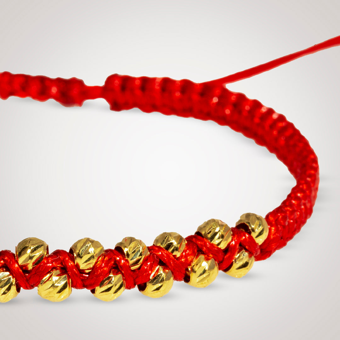 Pulsera Ixia con bolas diamantado en oro de 18K