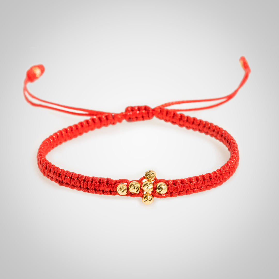 Pulsera Cross Lira con bolas diamantadas en oro de 18K